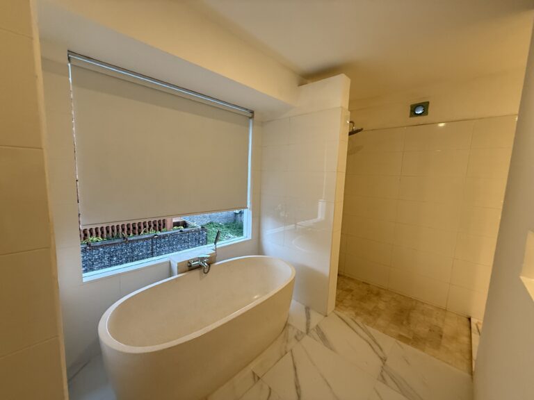 Bathroom with freestanding bathtub by the window at Panoramic Villa