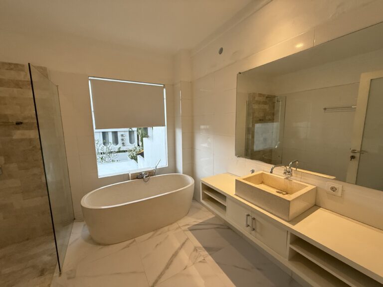 Bathroom with bathtub and vanity at Panoramic Villa