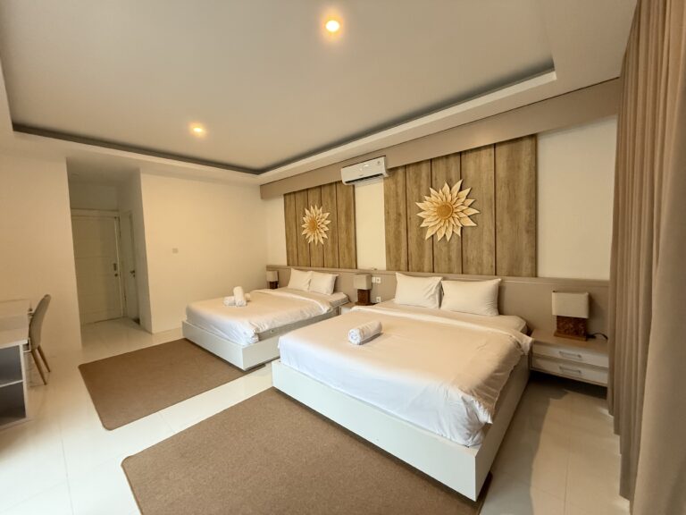Bedroom with king-size bed and decorative wall at Panoramic Villa