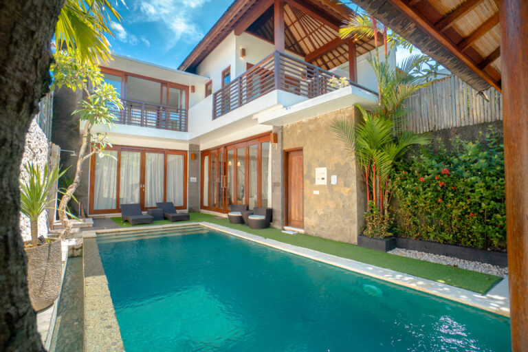 Private pool and two-storey villa with timber balcony at Villa Wisata