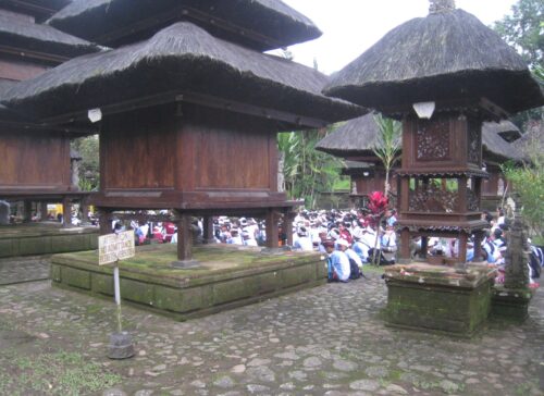 Tiered meru shrines in the stone courtyard of Pura Luhur Batukaru