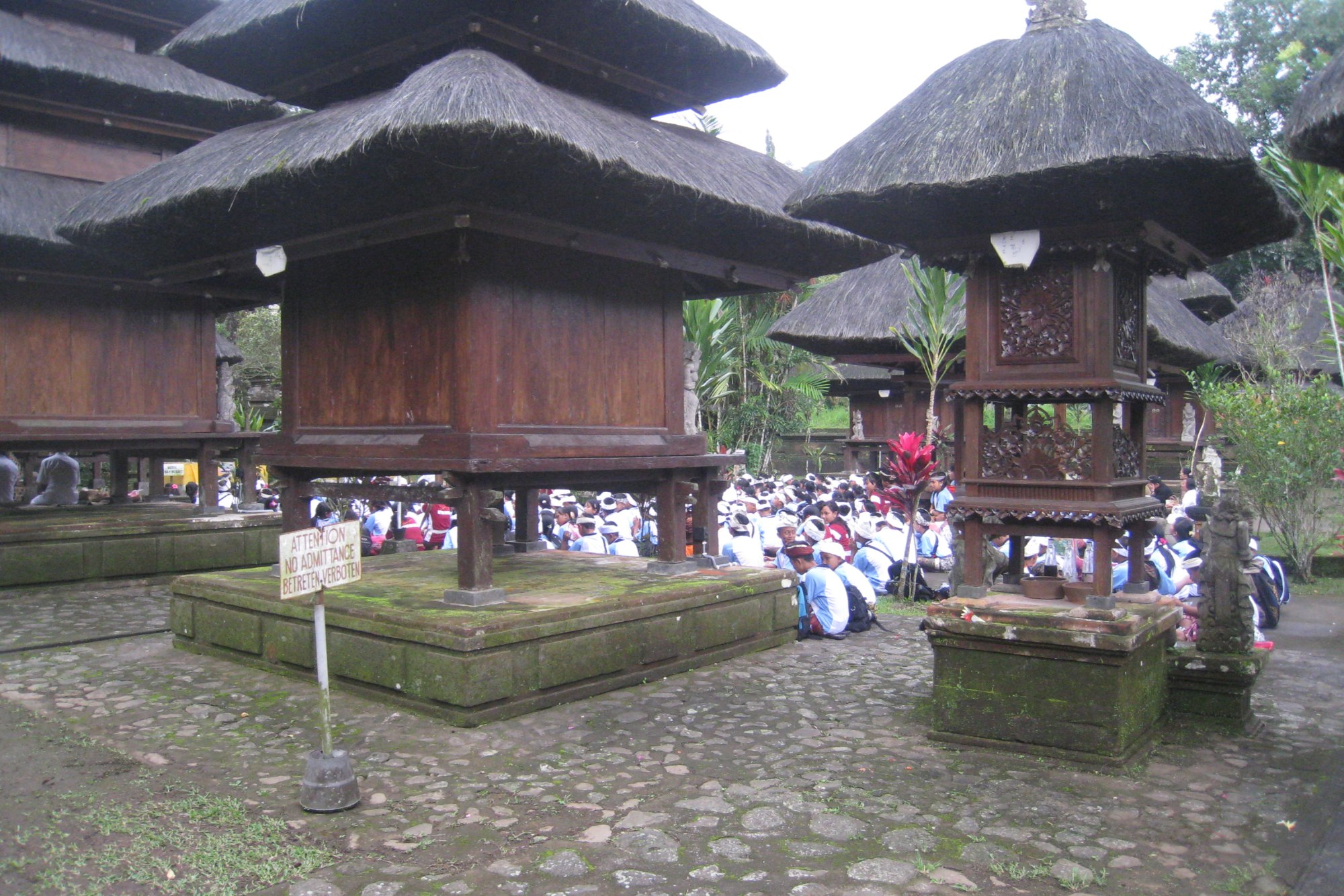 Tiered meru shrines in the stone courtyard of Pura Luhur Batukaru